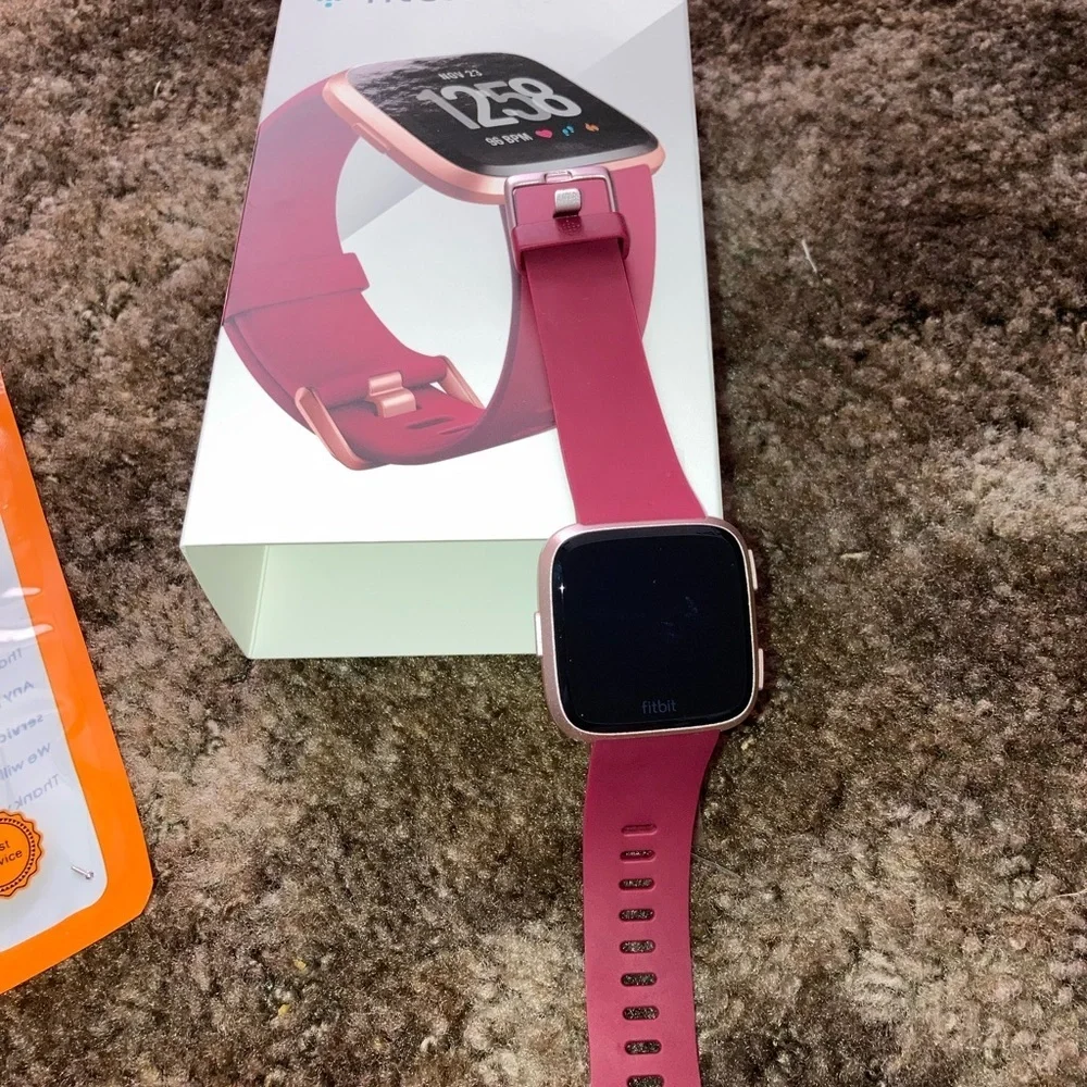 Rose Gold Fitbit Versa with Accessories all in excellent condition